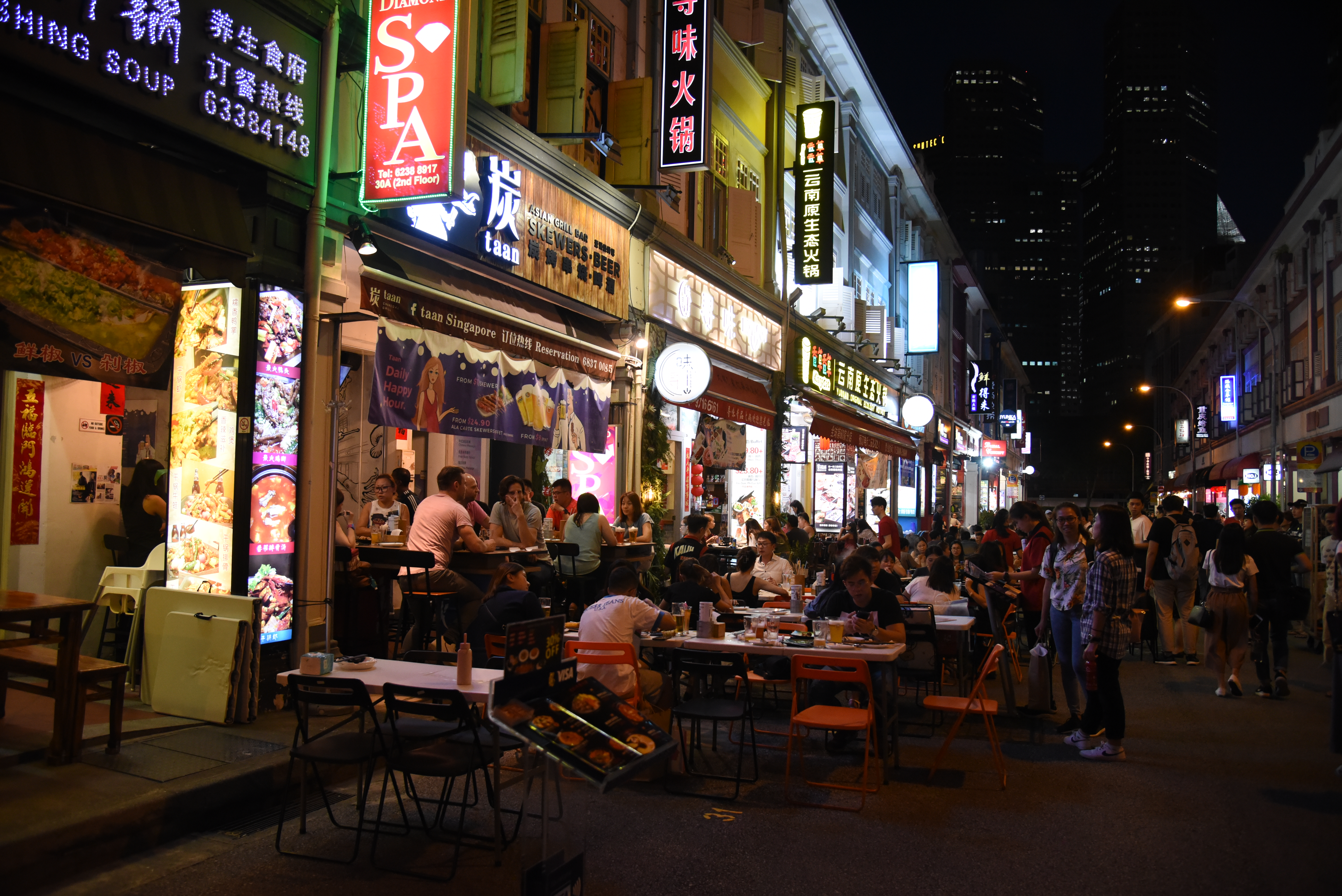 Liang Seah Street at night, with many people having a night out. 